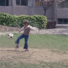 Boy kicking ball, Broomhall Flats. July 1978 | Photo: Tony Allwright