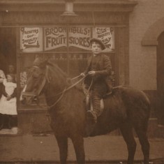 James William Cooper (aged 9) outside Cooper's Fruit & Veg shop, 135 Broomhall St, c.1905 | Photo: Edward Bell