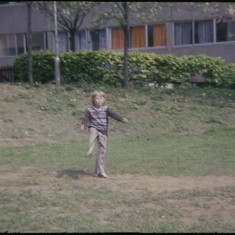 Boy kicking, Broomhall Flats. July 1978 | Photo: Tony Allwright