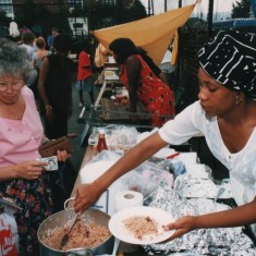 Woman serving food at the Carnival | Broomhall Centre archive